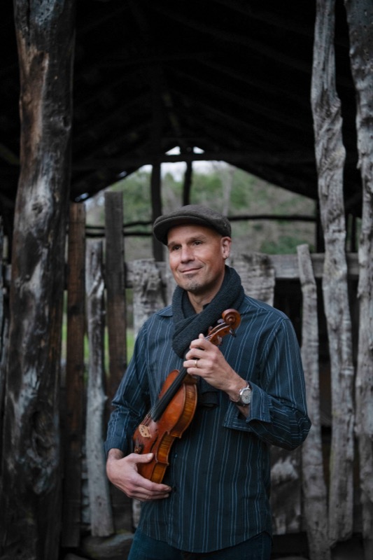 John Weed playing fiddle
